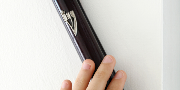 hand touching mezuzah