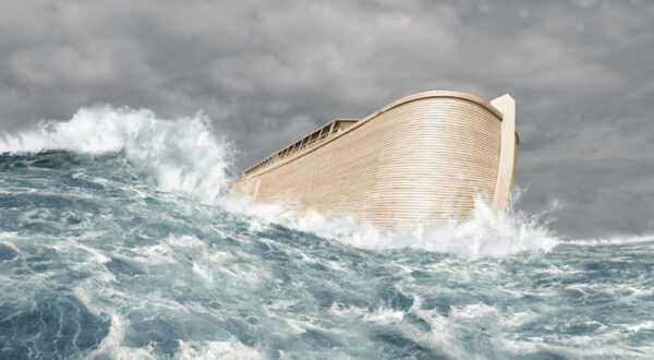 The hull of a boat featured on the water with gray sky in background