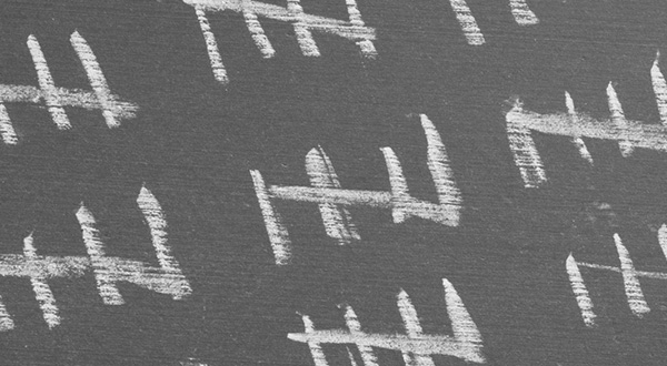 white hashmarks representing the number five on a gray background