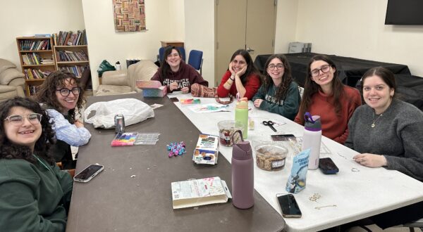 group of women sitting at a table together
