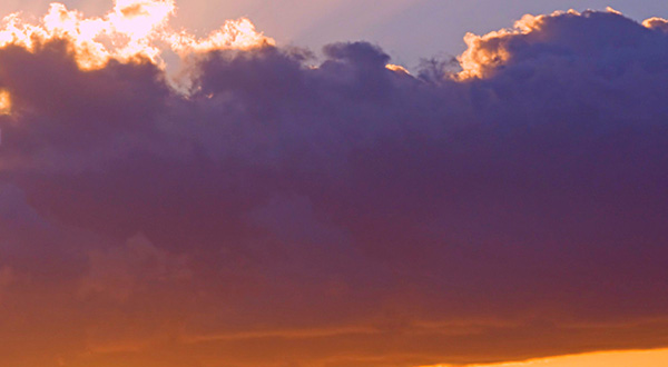 photo of deep purple and orange clouds