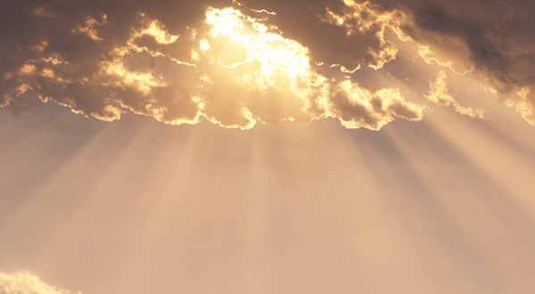 Clouds with light rays coming out and streaming downward