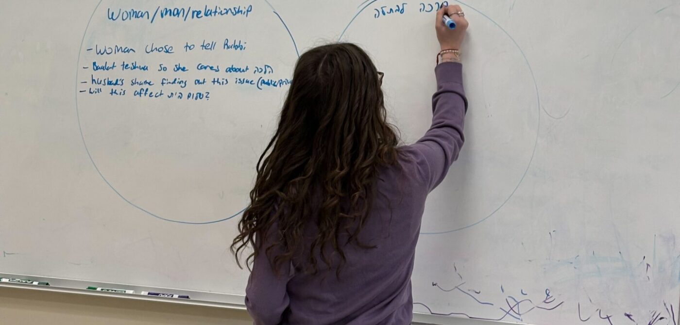 student at the white board