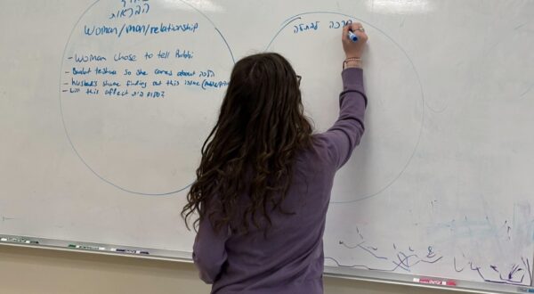 student at the white board